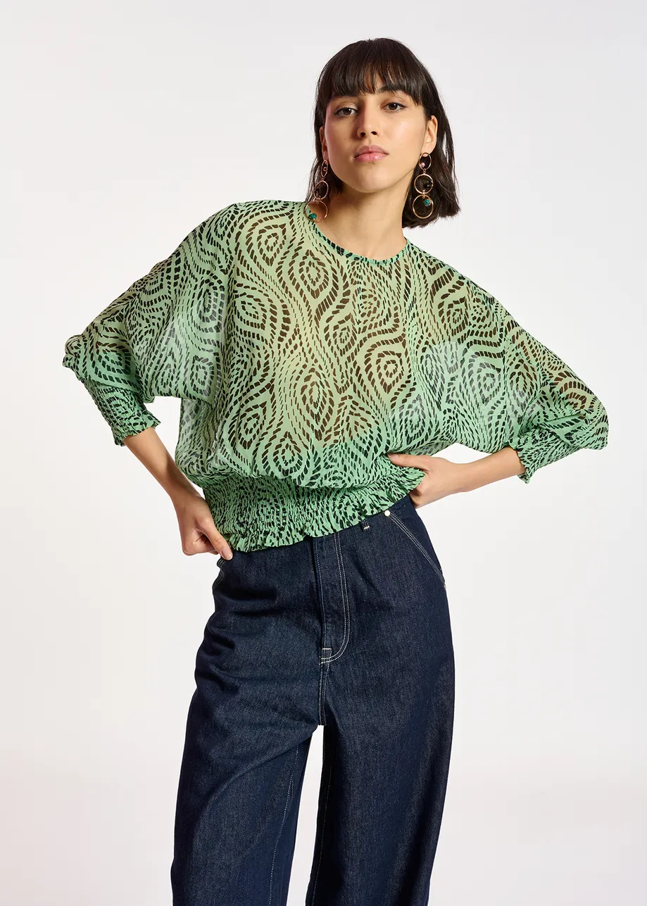 Mint green smocked top with geometric print