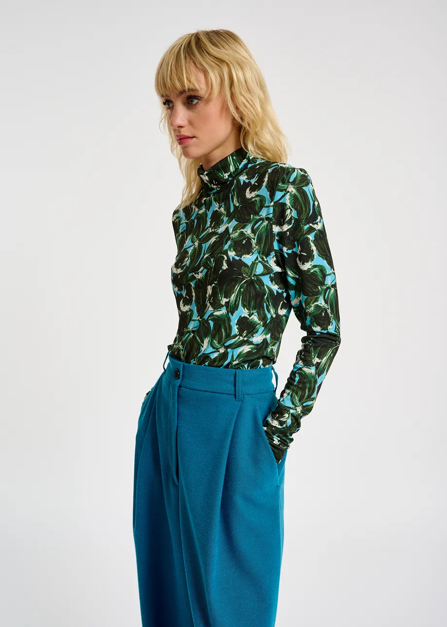 Blue and dark green leaf-print turtleneck top