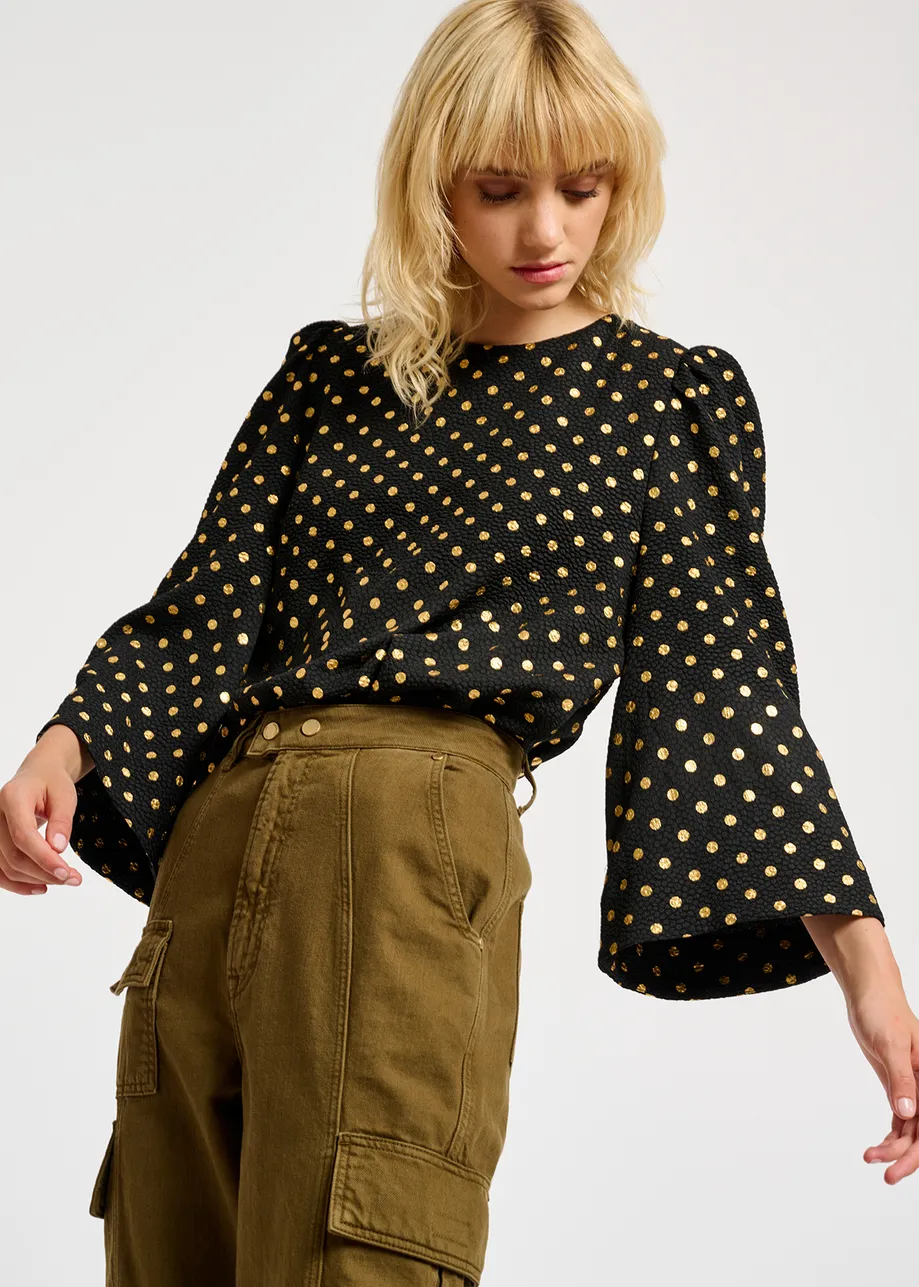 Black and gold polka-dot top with trumpet sleeves