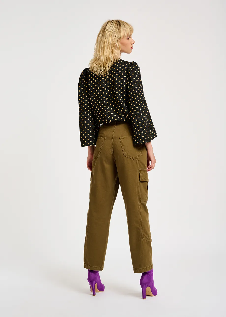 Black and gold polka-dot top with trumpet sleeves