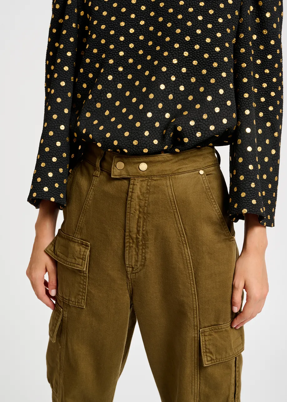 Black and gold polka-dot top with trumpet sleeves