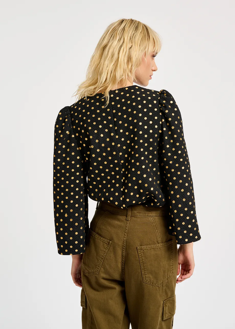 Black and gold polka-dot top with trumpet sleeves