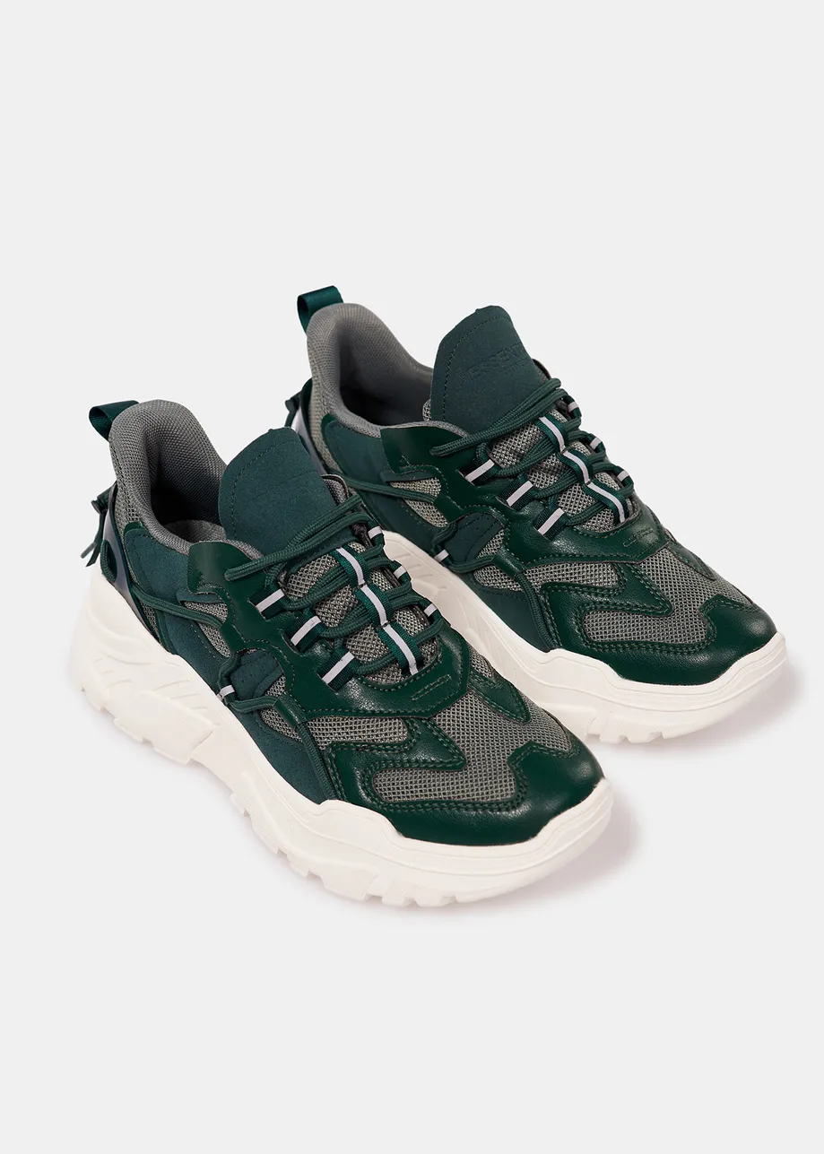 Dark green sneakers set on chunky white soles