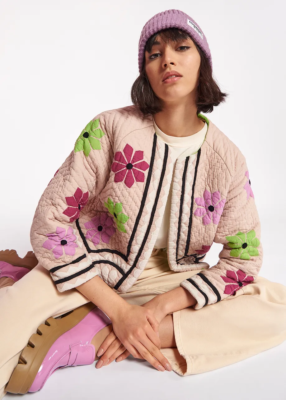 Off-white quilted jacket with flower patches
