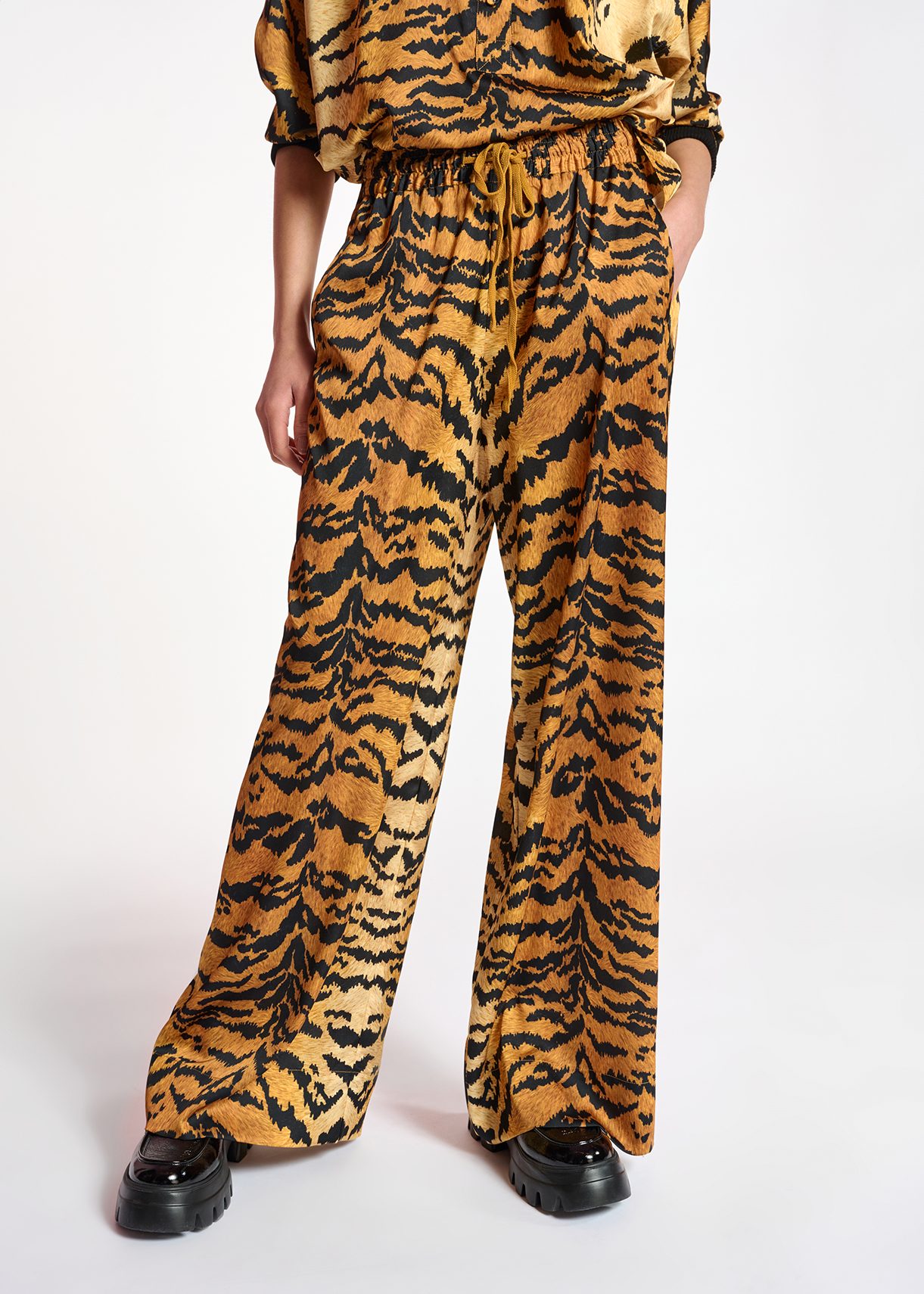 Brown wide-leg pants with tiger print