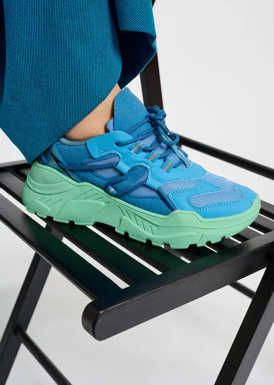 Blue sneakers set on chunky mint green soles