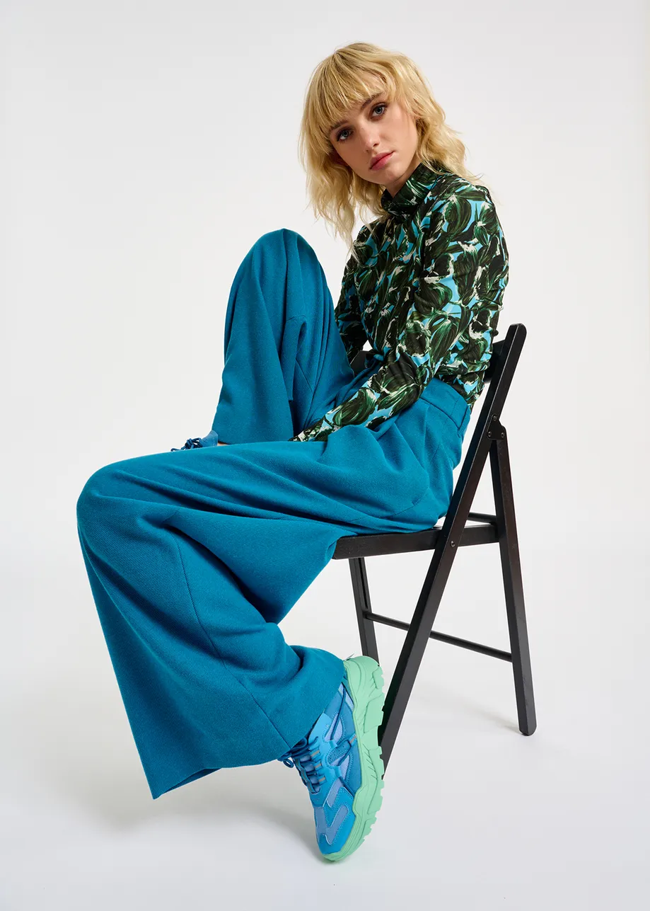 Blue sneakers set on chunky mint green soles