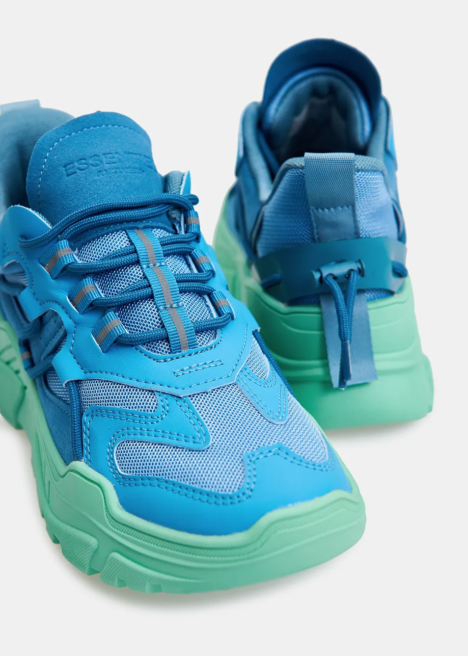 Blue sneakers set on chunky mint green soles