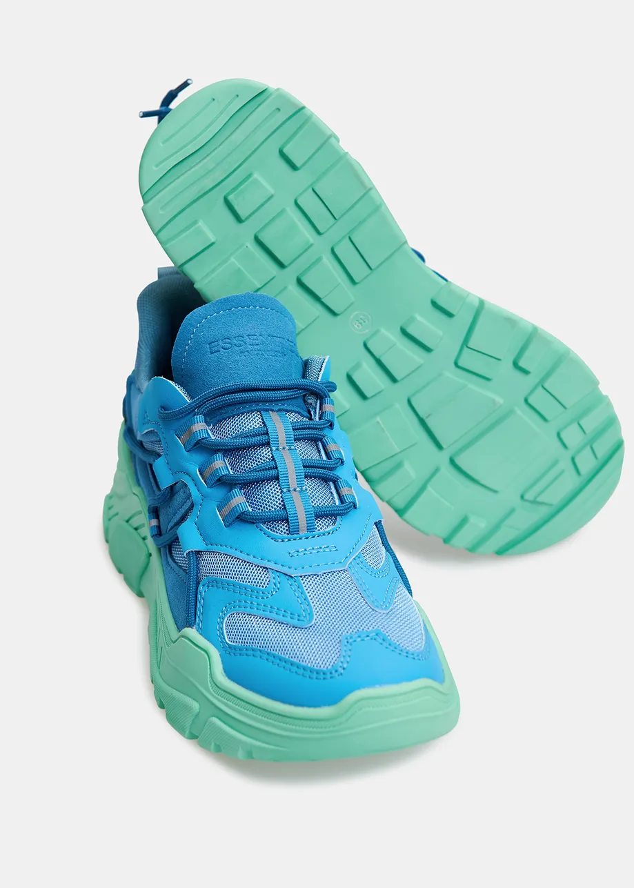 Blue sneakers set on chunky mint green soles