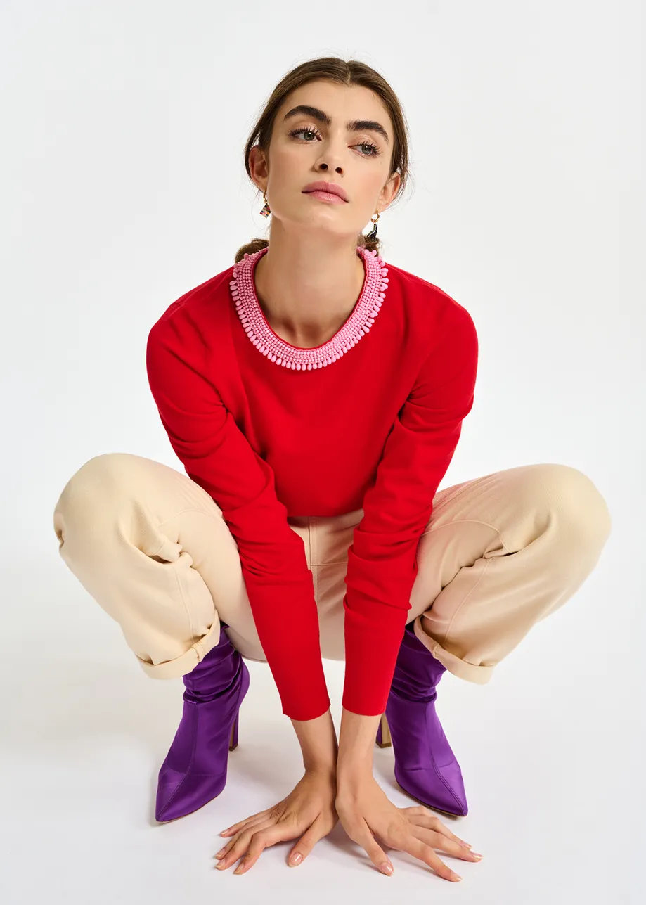 Red fine-knit sweater with bead-embroidered neckline