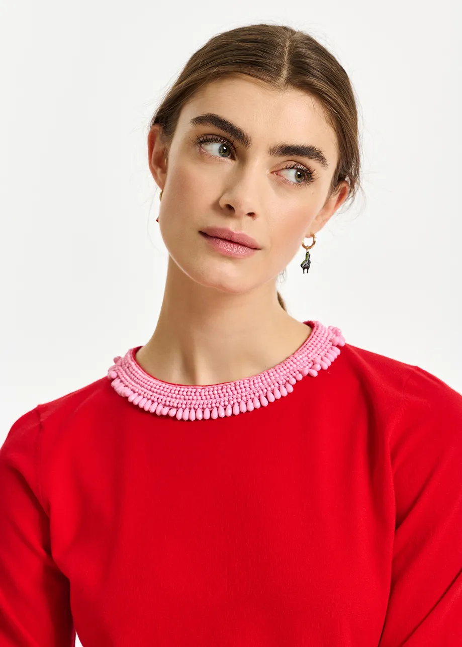 Red fine-knit sweater with bead-embroidered neckline
