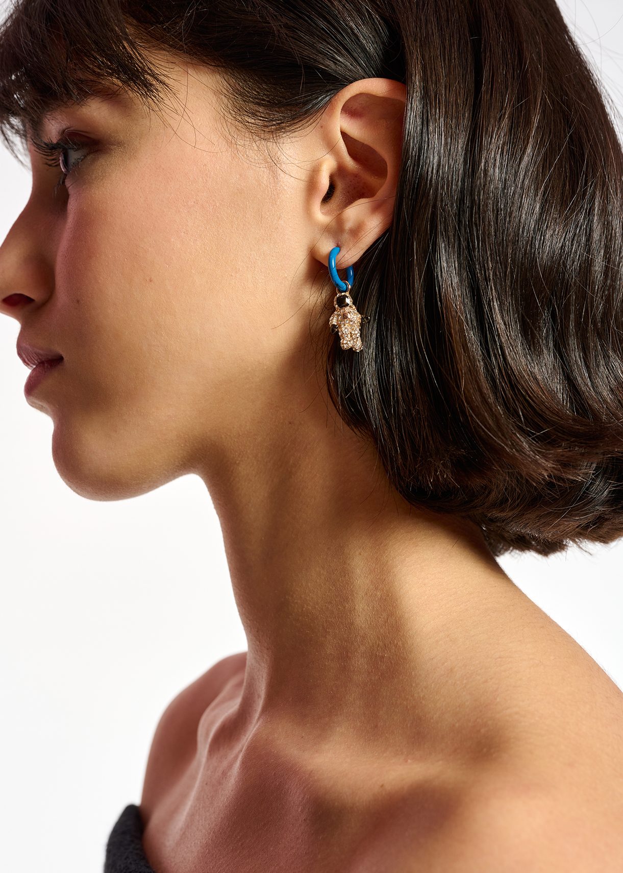 Blue hoop earrings with astronaut and space shuttle pendants