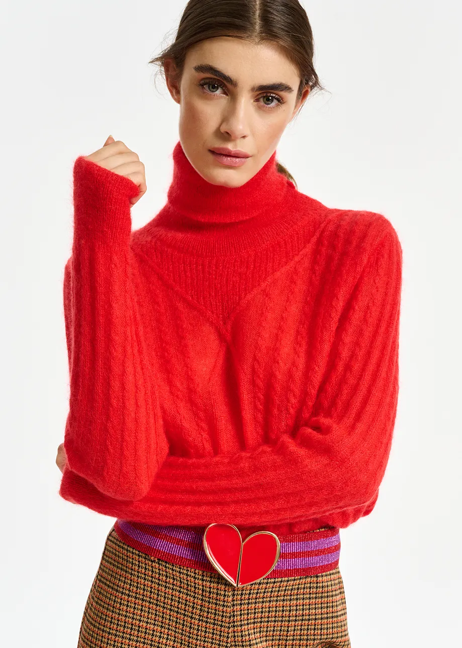 Red cable-knitted turtleneck sweater