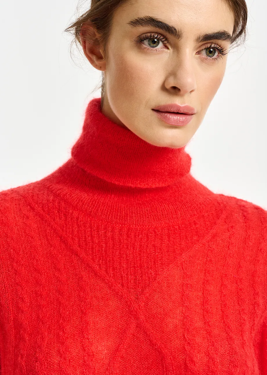 Red cable-knitted turtleneck sweater