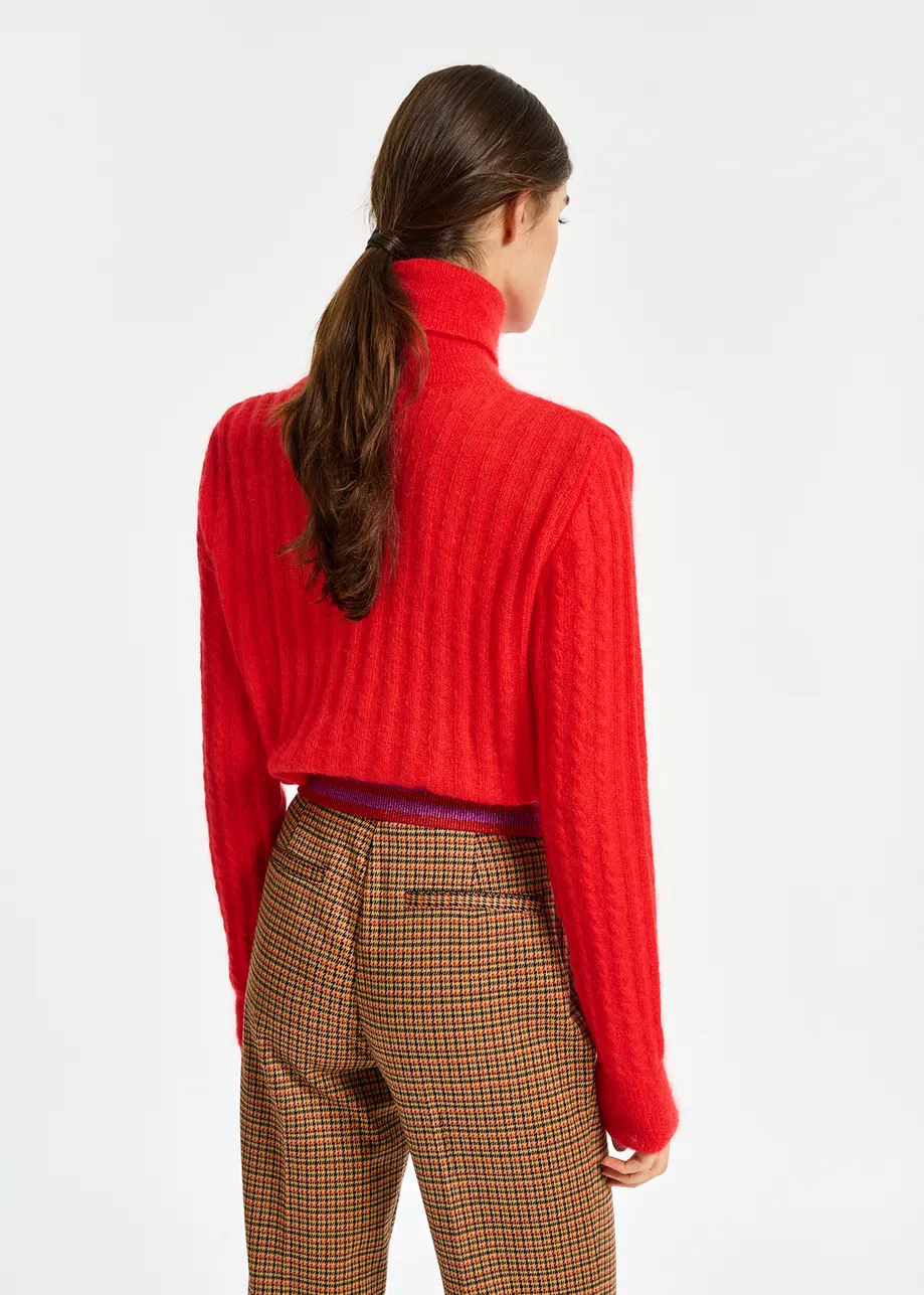 Red cable-knitted turtleneck sweater