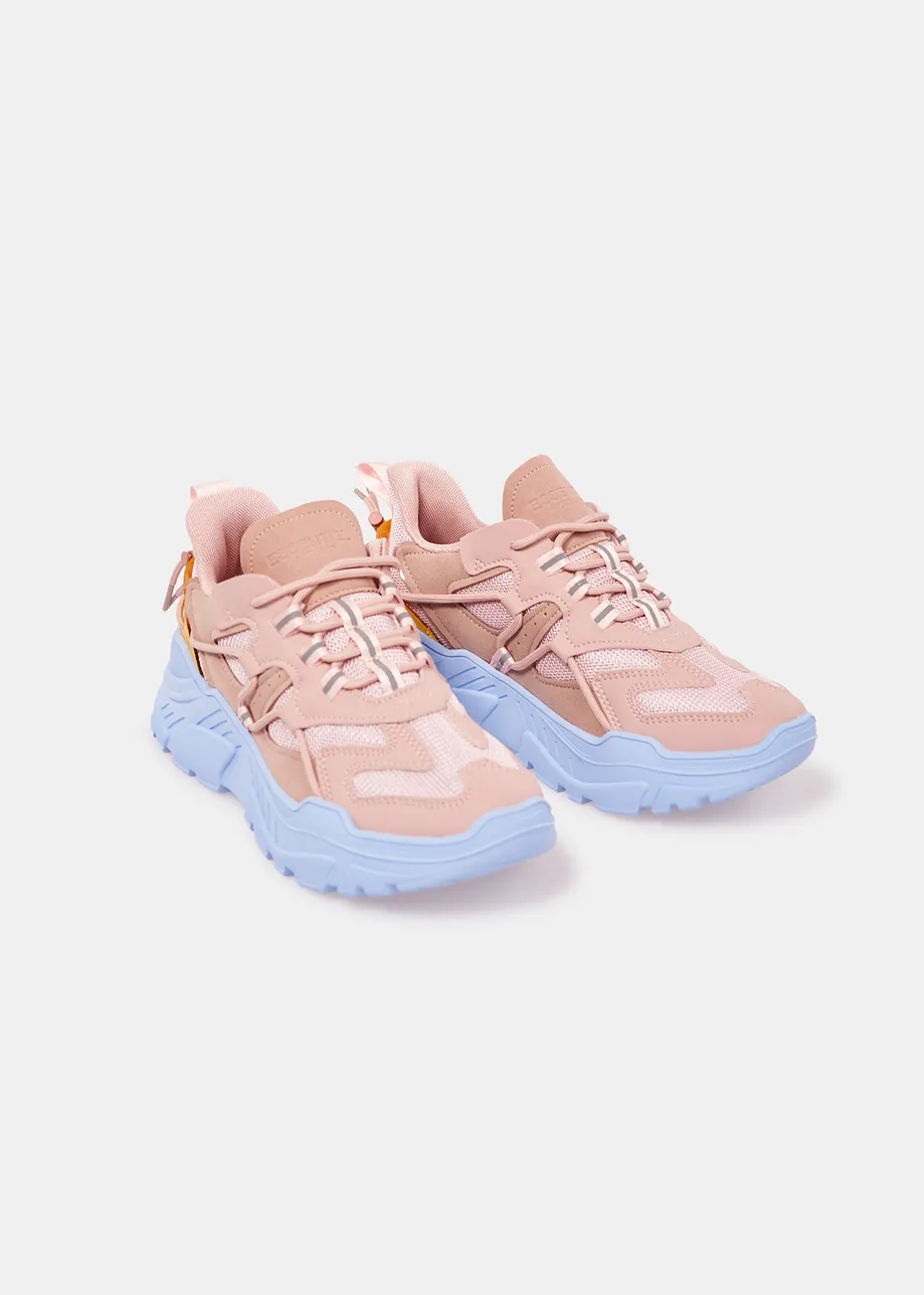 Vintage pink sneakers set on chunky blue soles