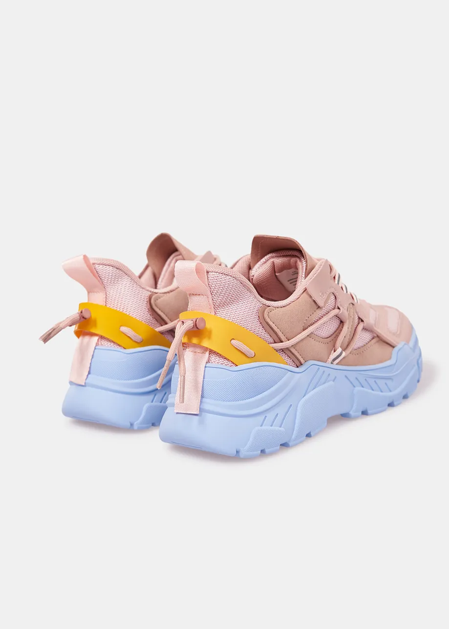 Vintage pink sneakers set on chunky blue soles