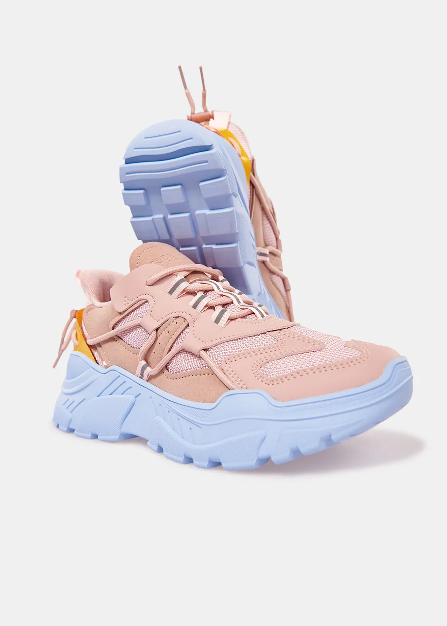 Vintage pink sneakers set on chunky blue soles