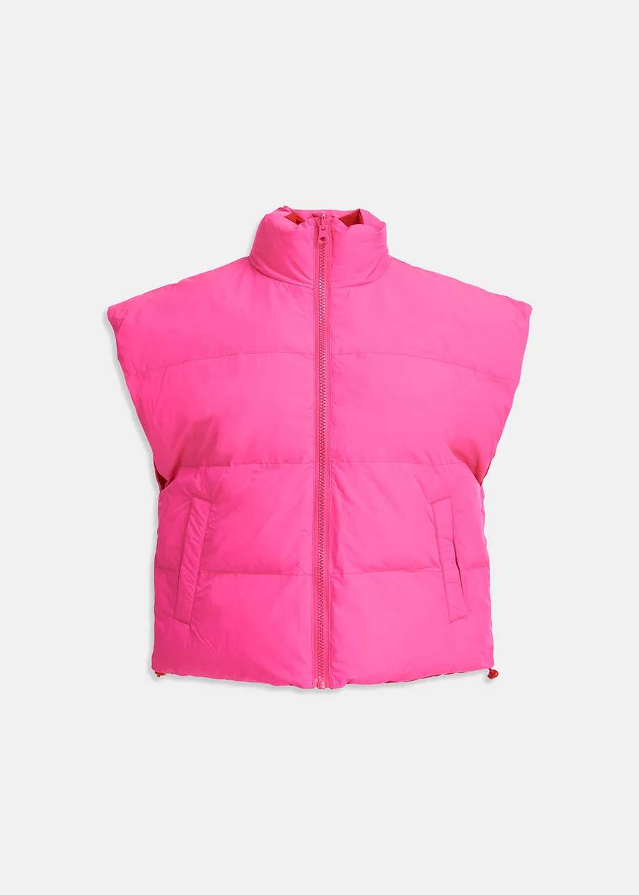 Neon pink and red reversible puffer vest