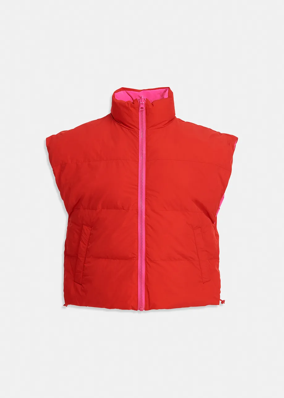 Neon pink and red reversible puffer vest