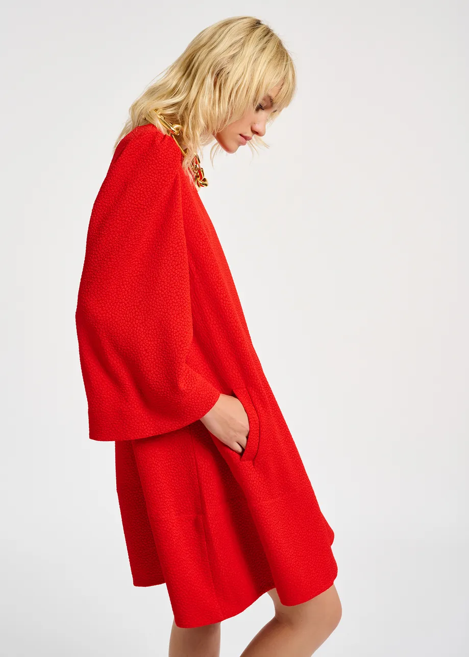 Red mini dress with trumpet sleeves