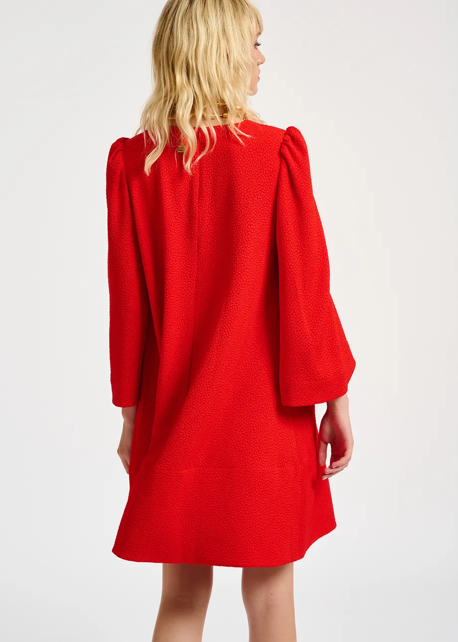 Red mini dress with trumpet sleeves