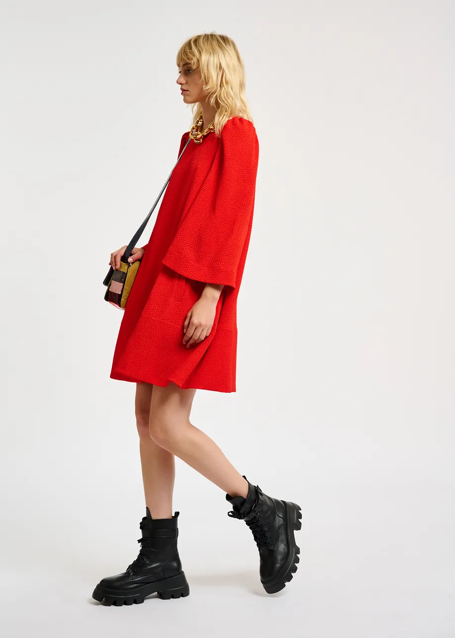 Red mini dress with trumpet sleeves