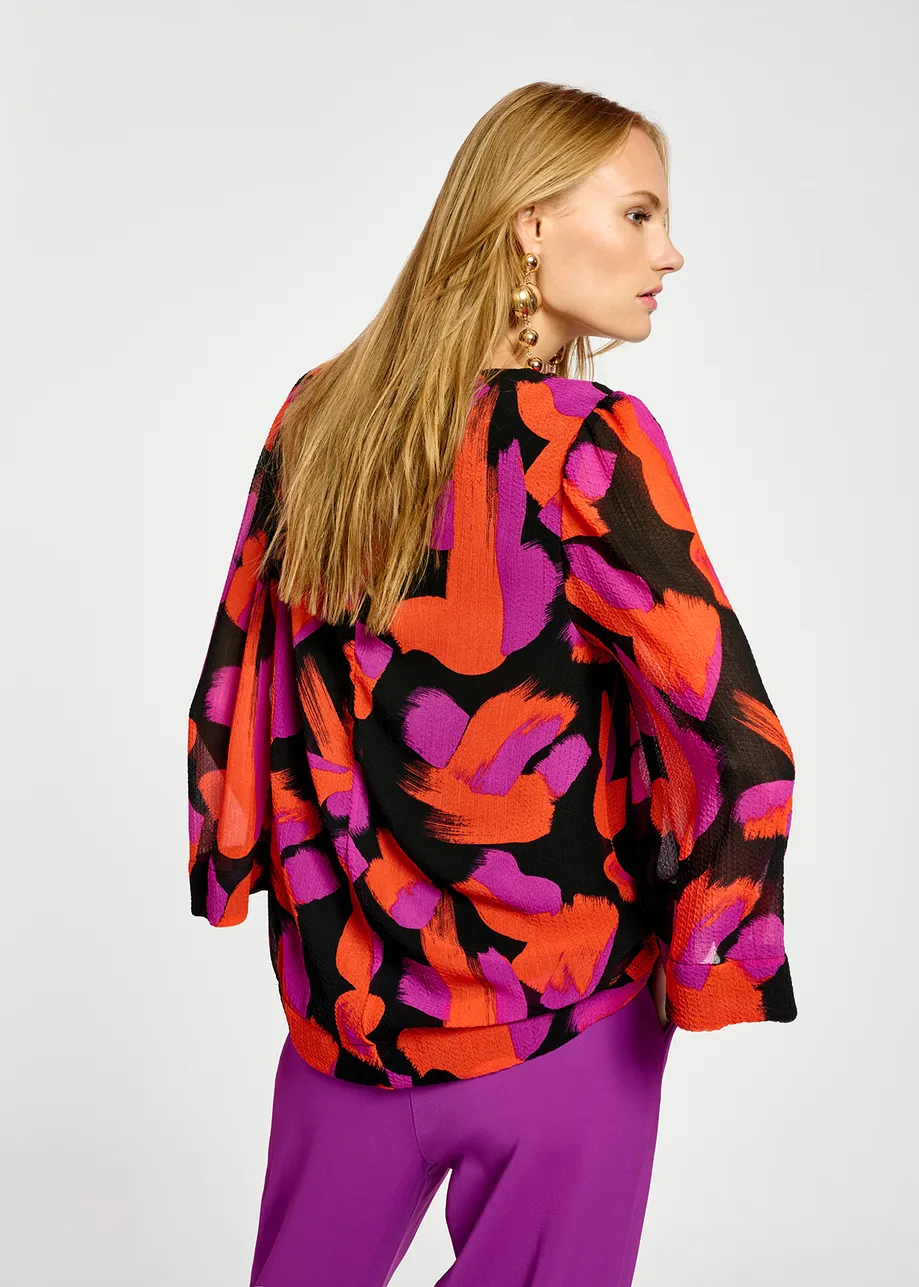 Black, orange and purple abstract-print top with puffed shoulders