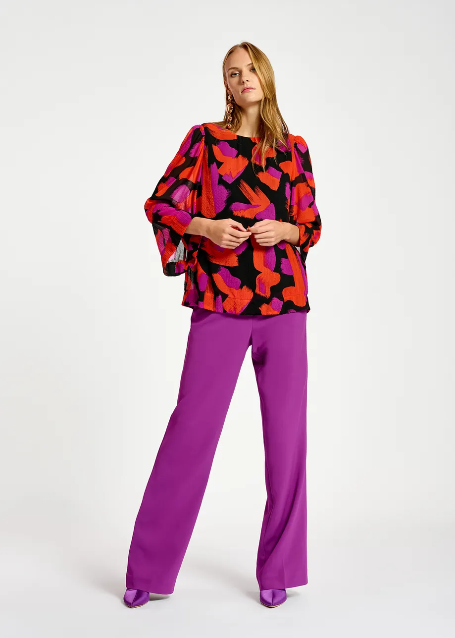 Black, orange and purple abstract-print top with puffed shoulders