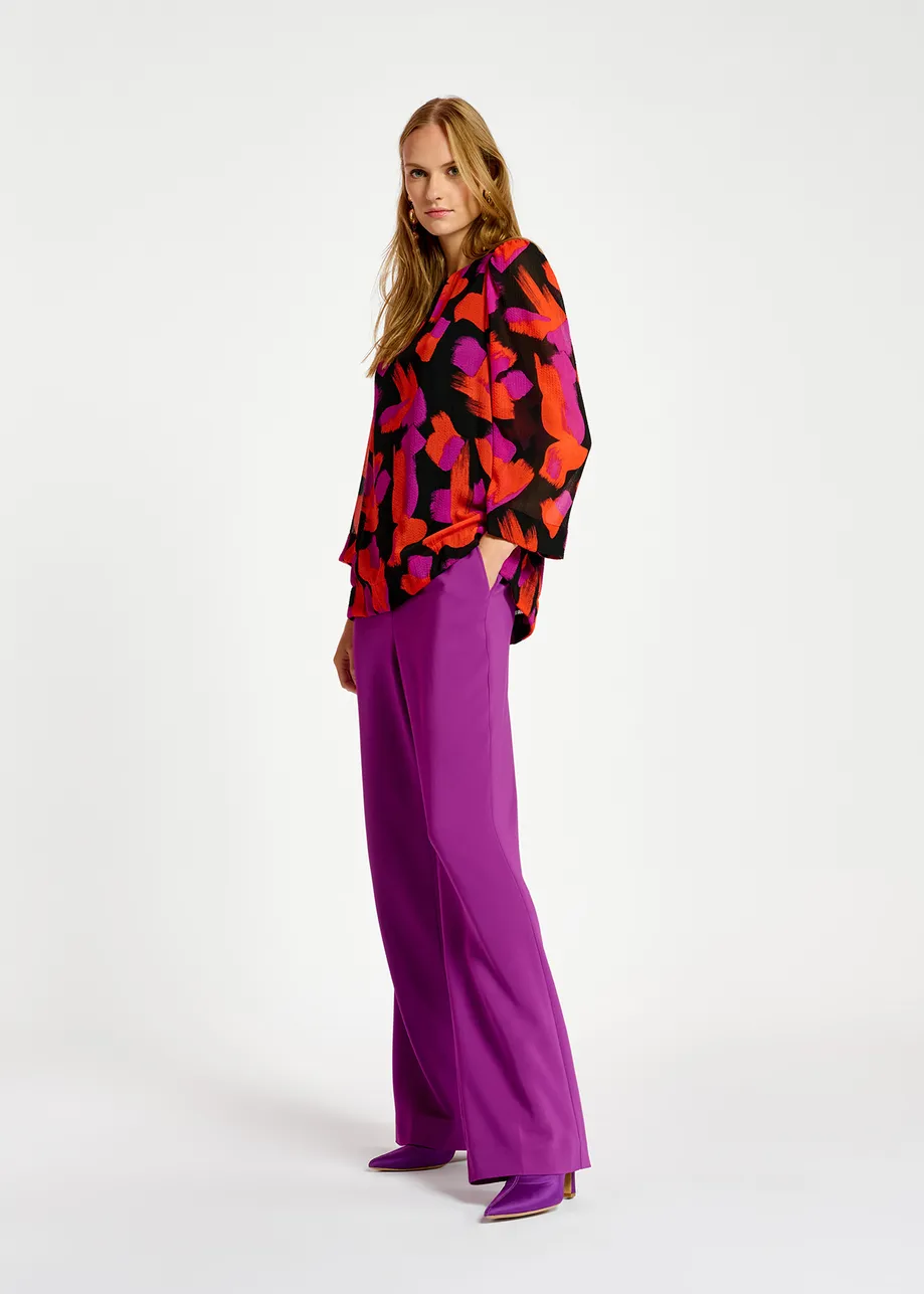 Black, orange and purple abstract-print top with puffed shoulders