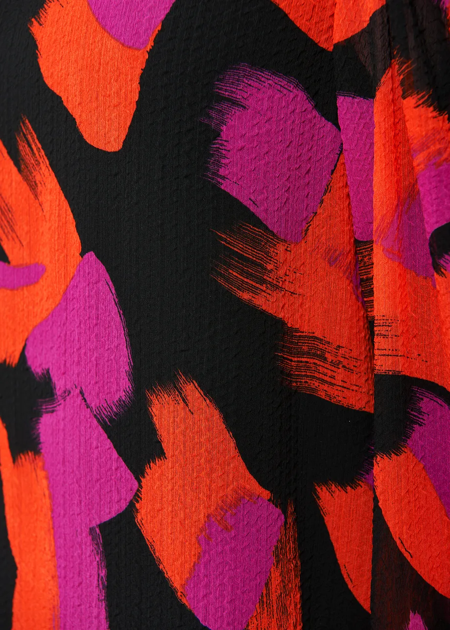 Black, orange and purple abstract-print top with puffed shoulders