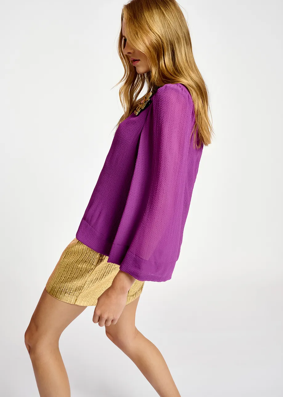 Purple top with puffed shoulders