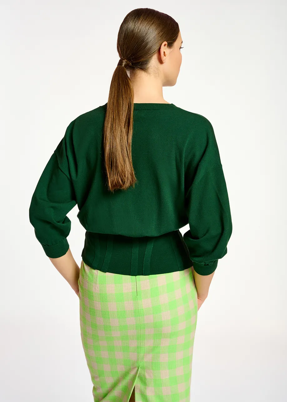 Pull vert foncé à taille cintrée