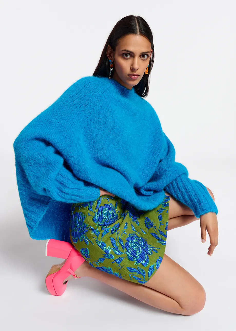 Blue knit sweater with cape effect