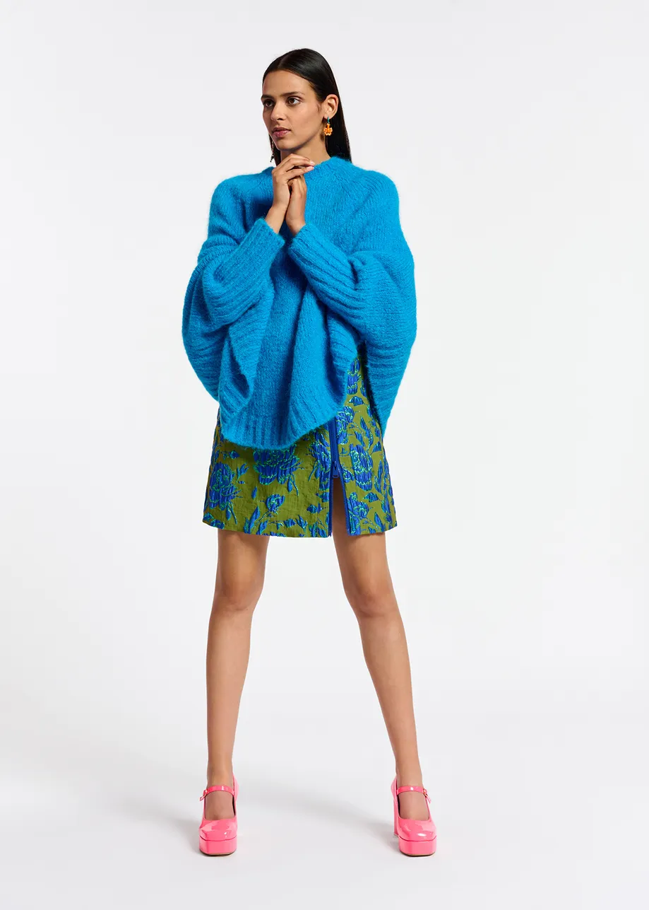 Blue knit sweater with cape effect