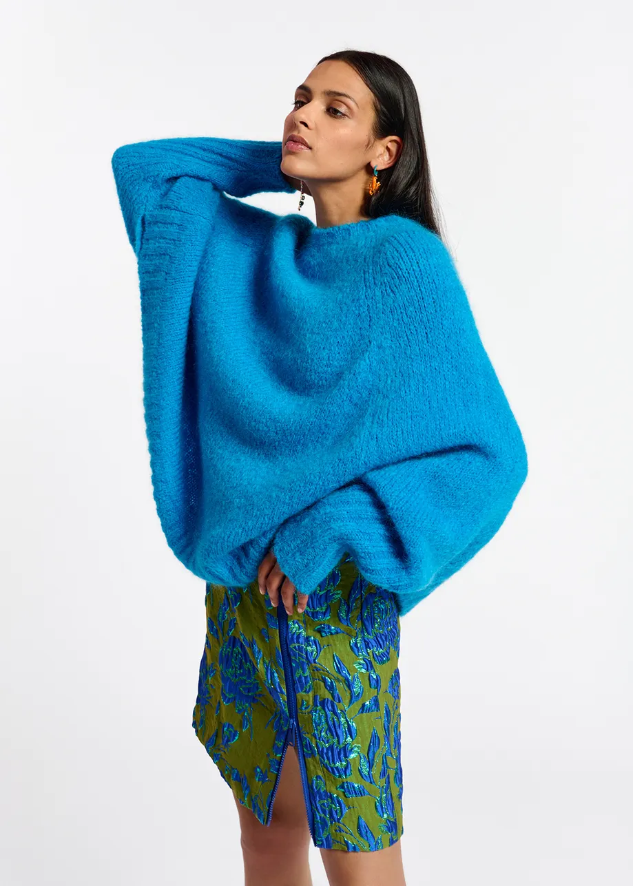 Blue knit sweater with cape effect