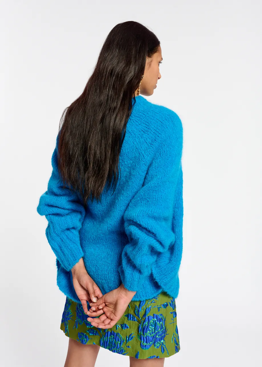 Blue knit sweater with cape effect