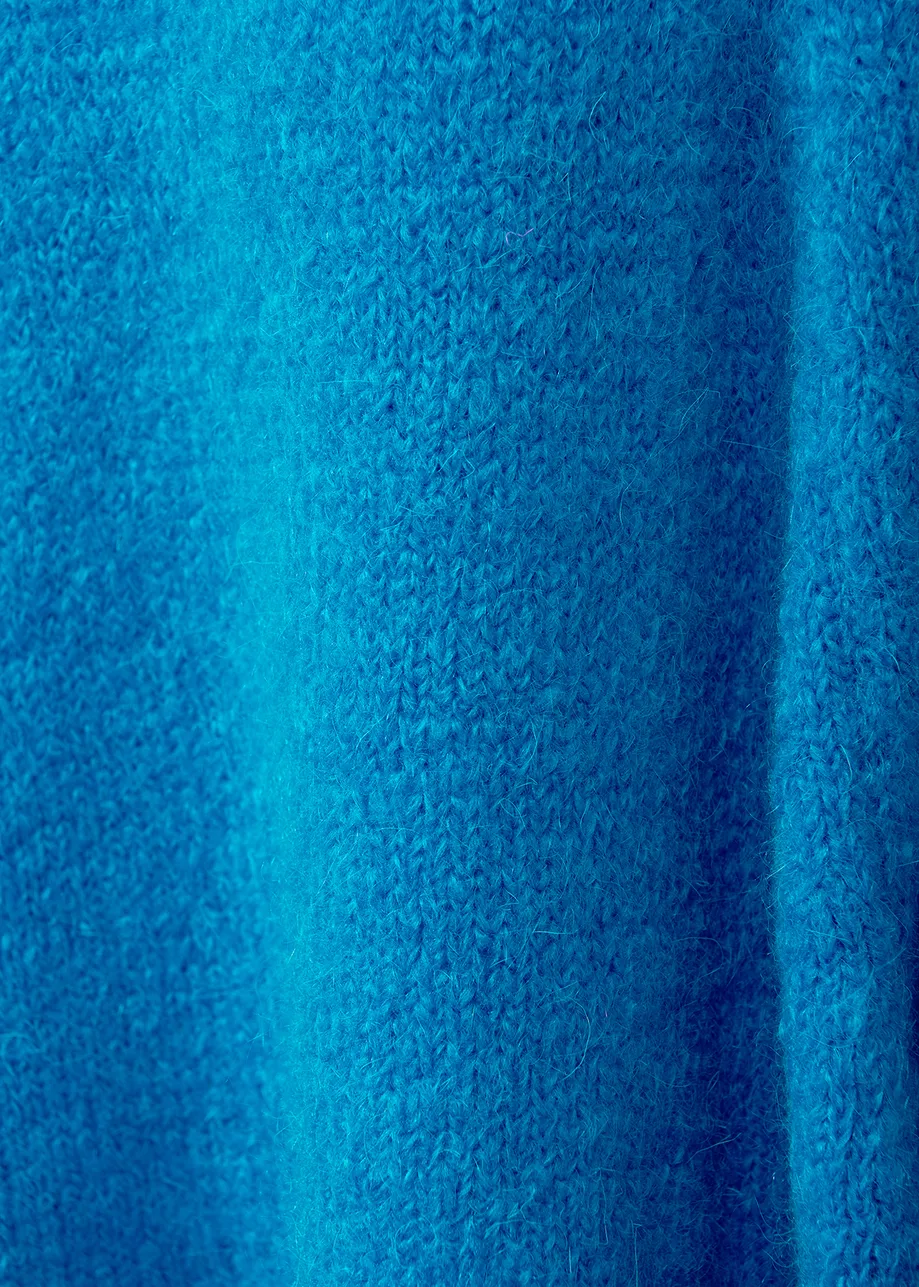 Blue knit sweater with cape effect