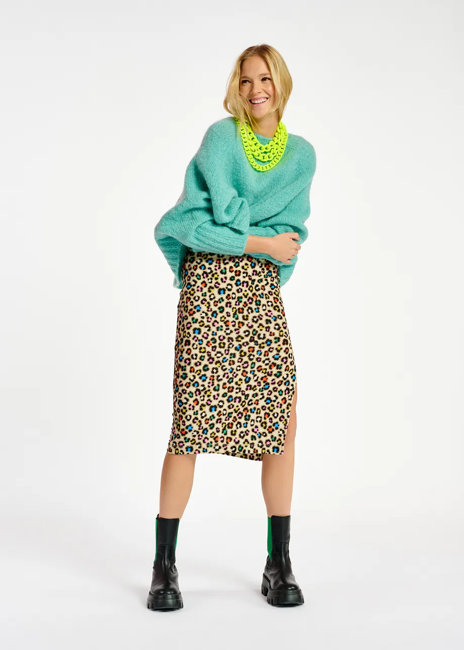 Turquoise knit sweater with cape effect