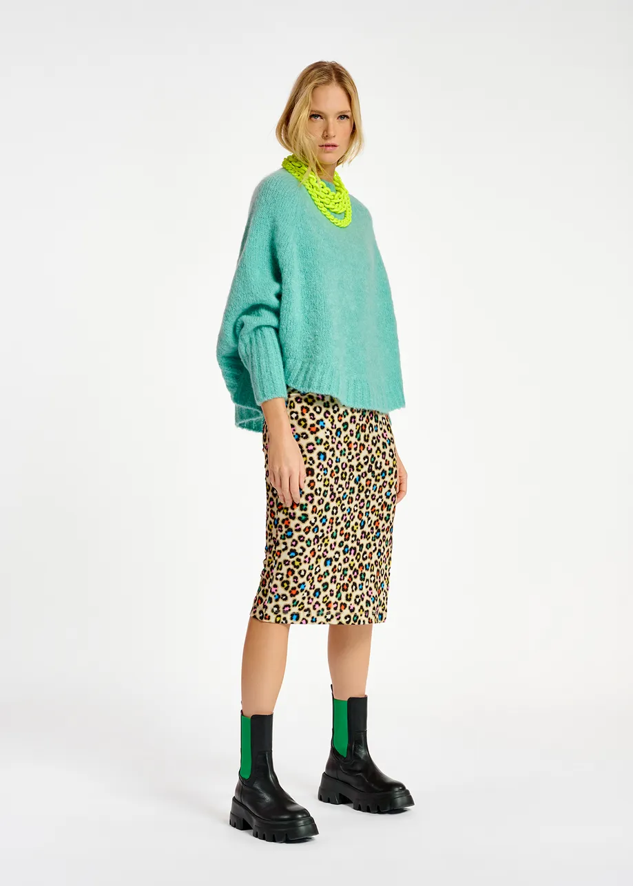 Turquoise knit sweater with cape effect