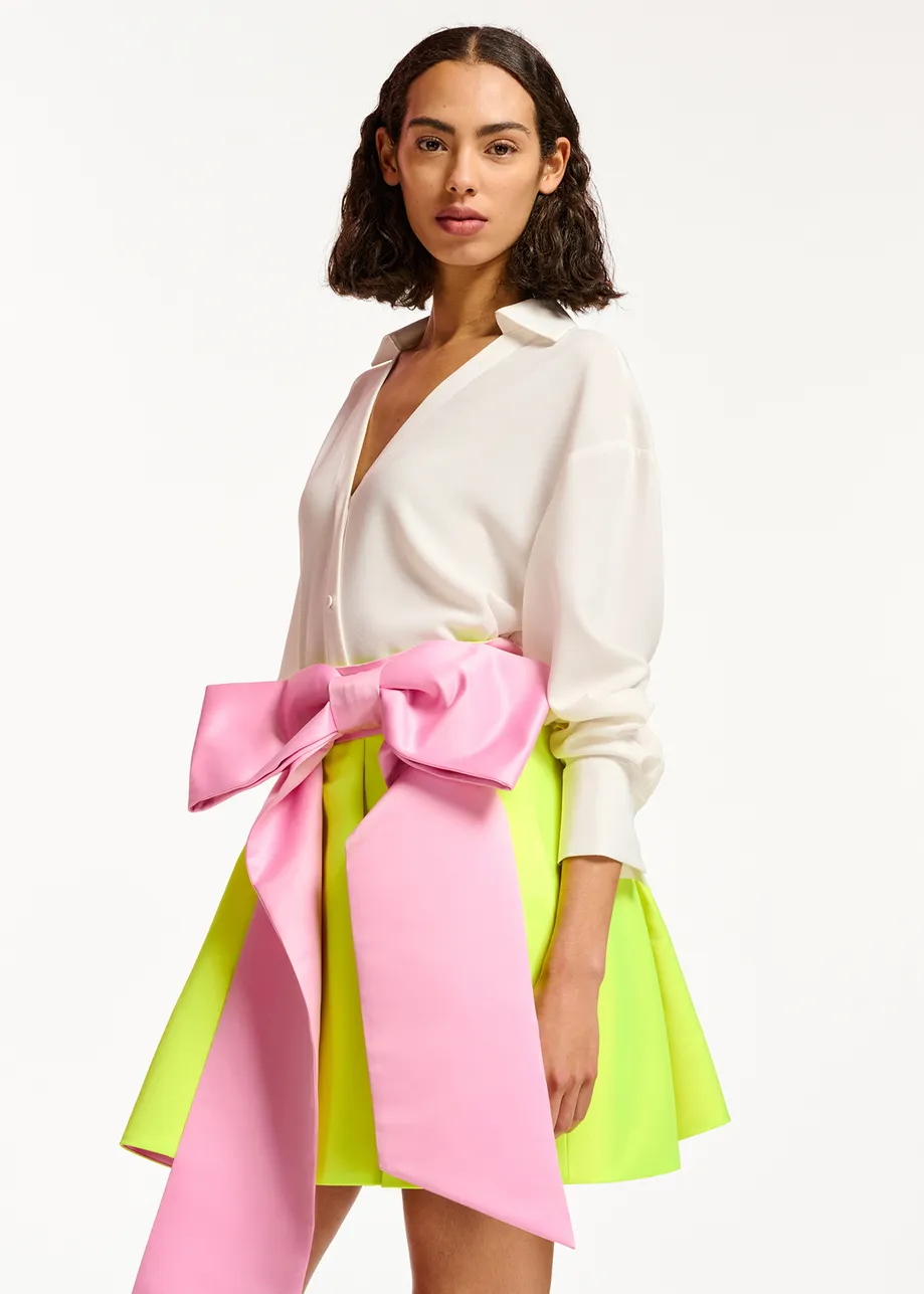 Yellow mini skirt with pink taffeta bow
