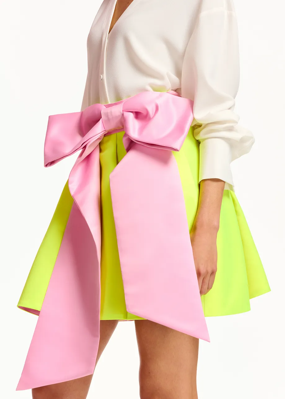 Yellow mini skirt with pink taffeta bow