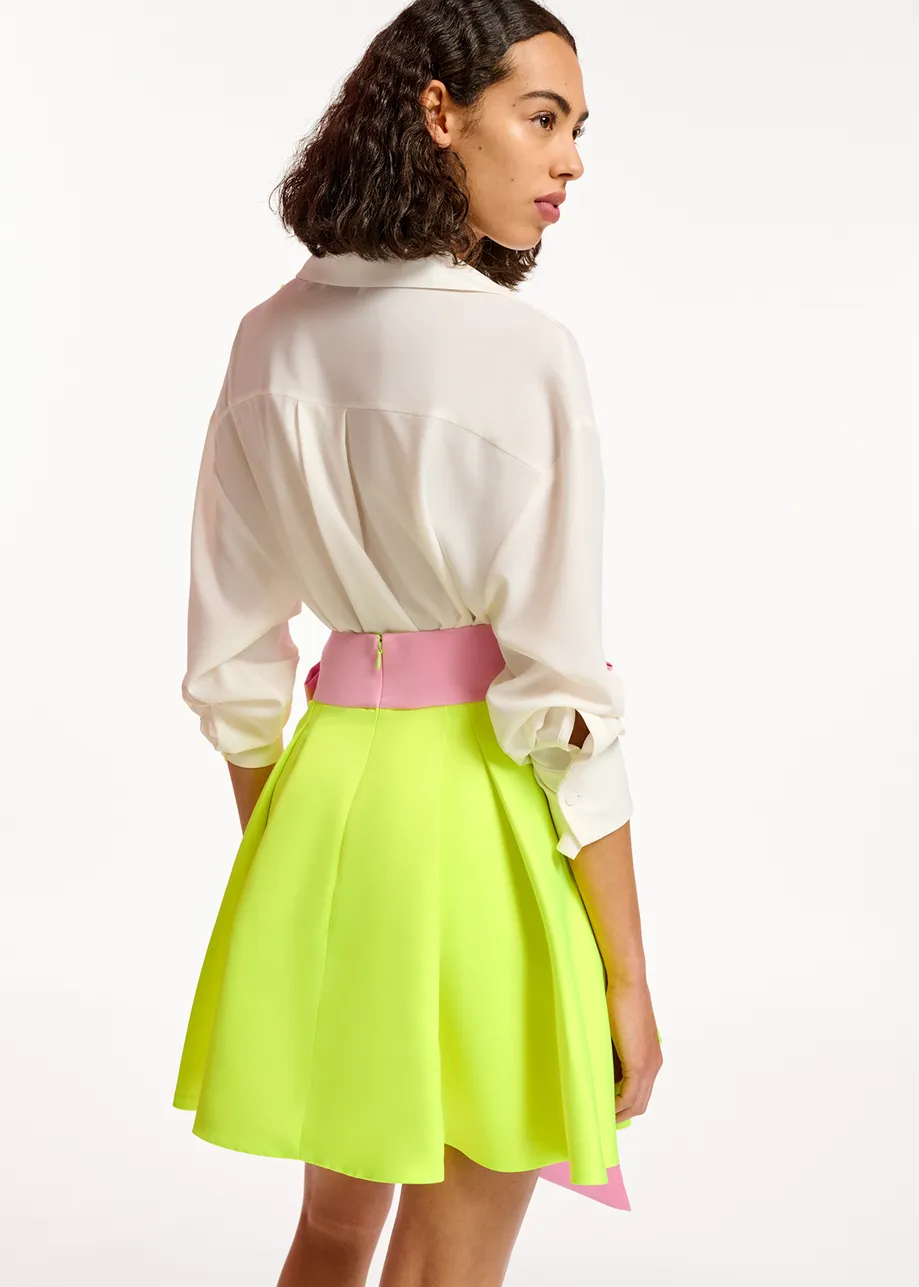 Yellow mini skirt with pink taffeta bow