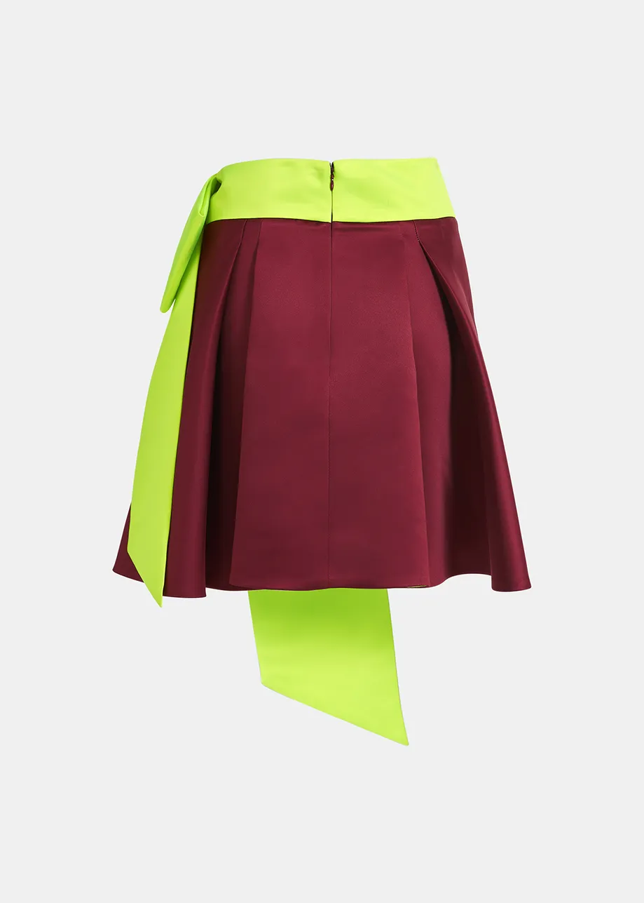 Mini-jupe bordeaux avec nœud jaune fluo