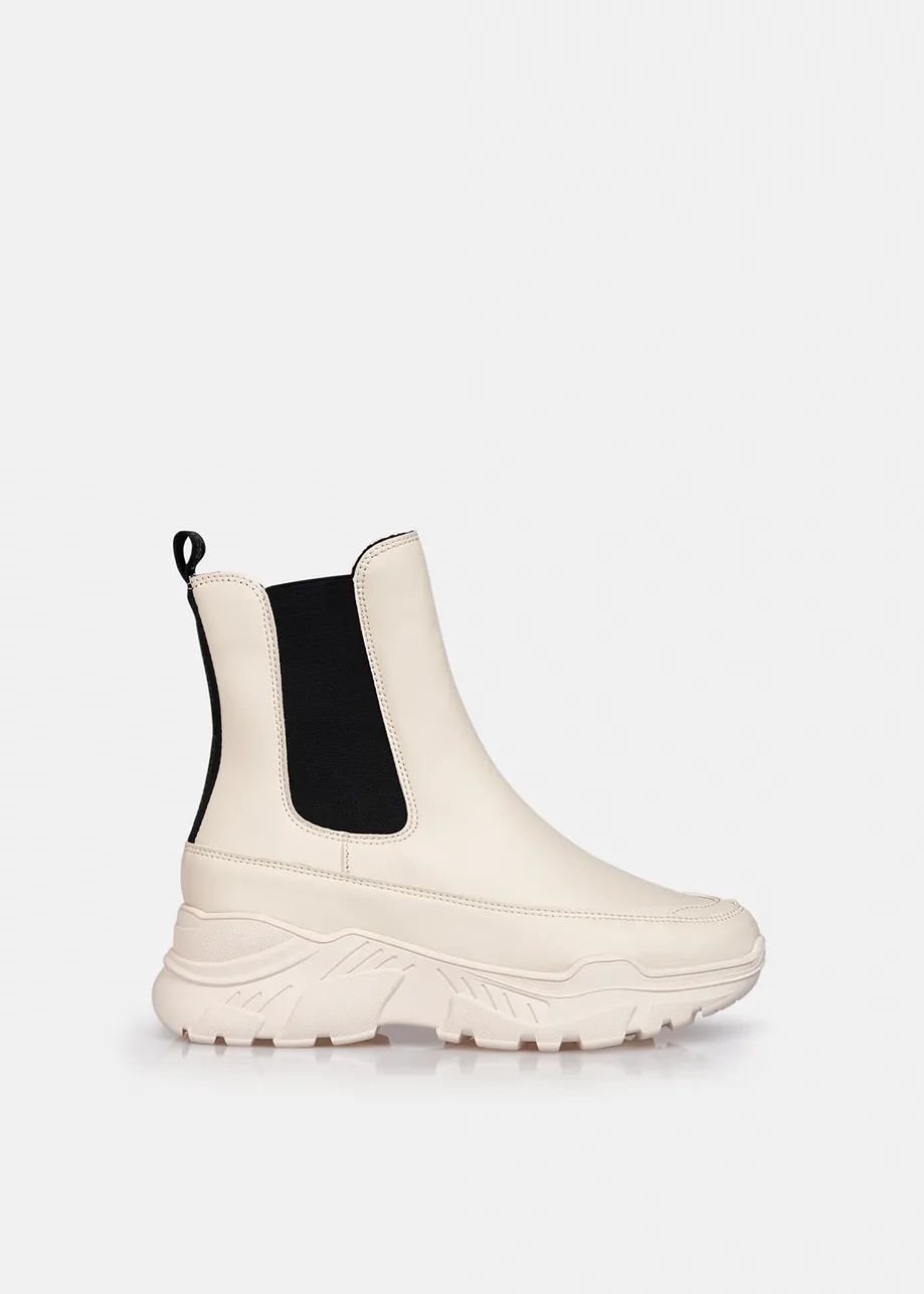 Bottines chelsea blanches avec languettes noires