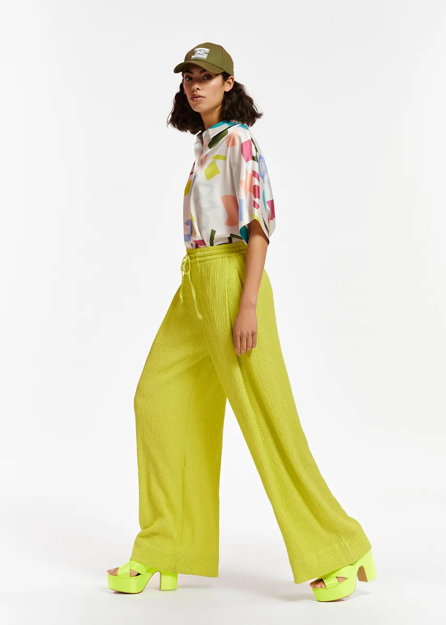 Lime green wide-leg seersucker pants