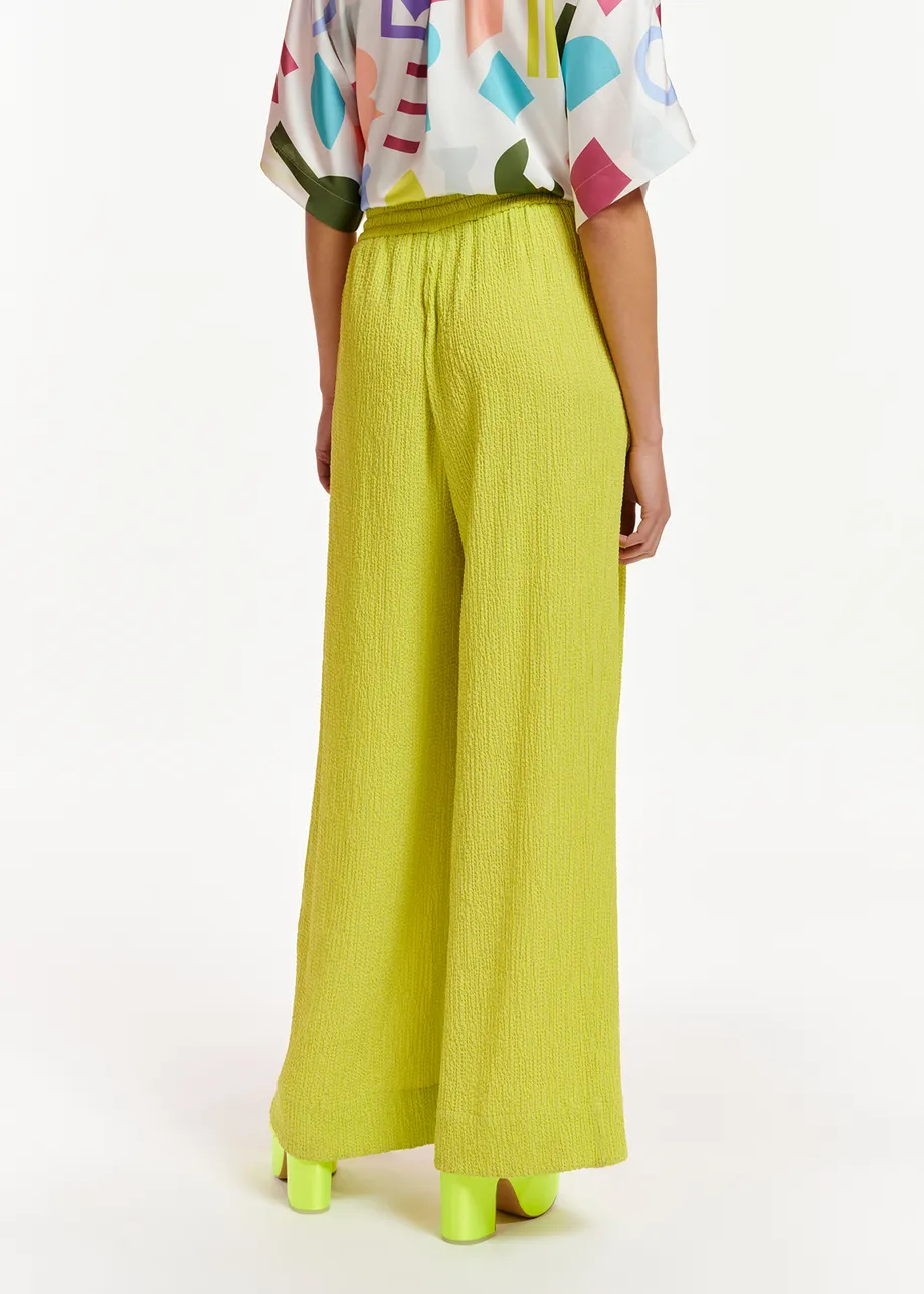 Lime green wide-leg seersucker pants