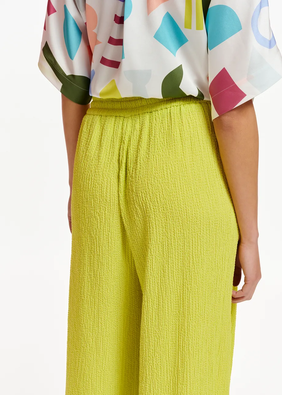Lime green wide-leg seersucker pants