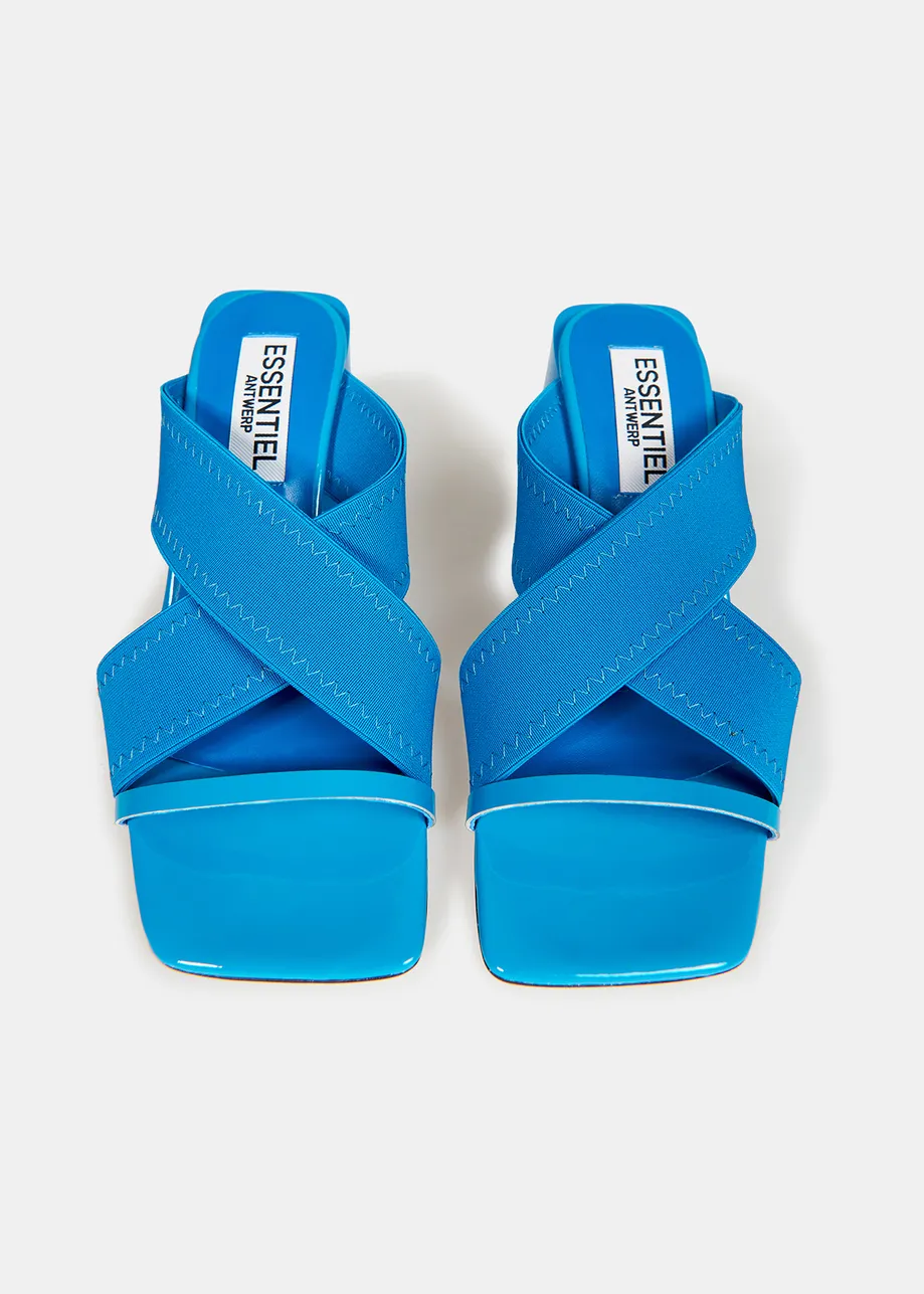 Blue crossover-strap mules