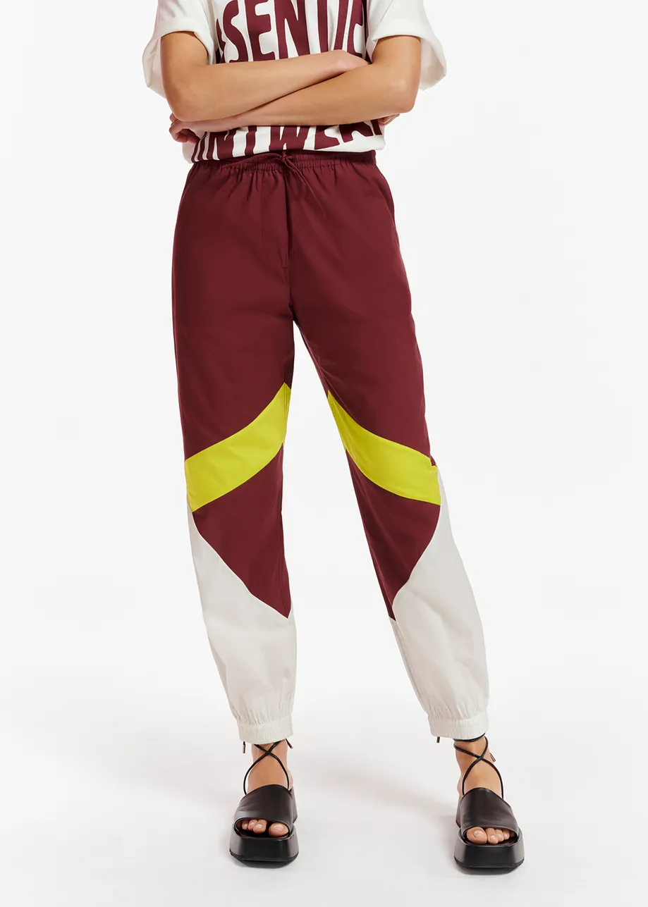 Burgundy, white and lime green cotton track pants